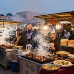 Corsi di Cucina a Marrakech: Imparare Tajine e Couscous 2026 2 Bancarelle di street food in Piazza Jemaa el-Fna a Marrakech
