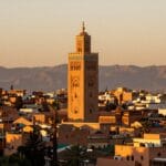 Quando Visitare Marrakech: Clima Meteo Periodo Migliore 2026 4 Panorama della città rossa di Marrakech con la Moschea Koutoubia al tramonto, guida marrakech